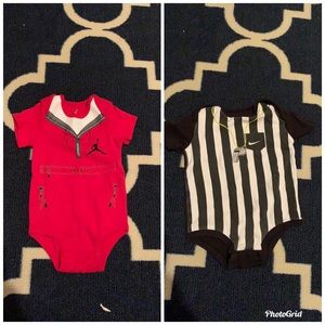 Two onesies. Nike & Jordan